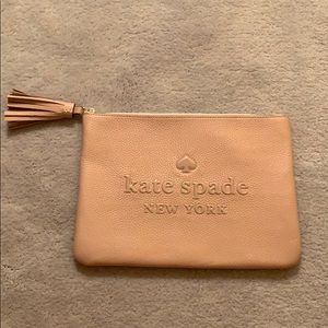 Light pink brand new kate spade clutch w/ tassel